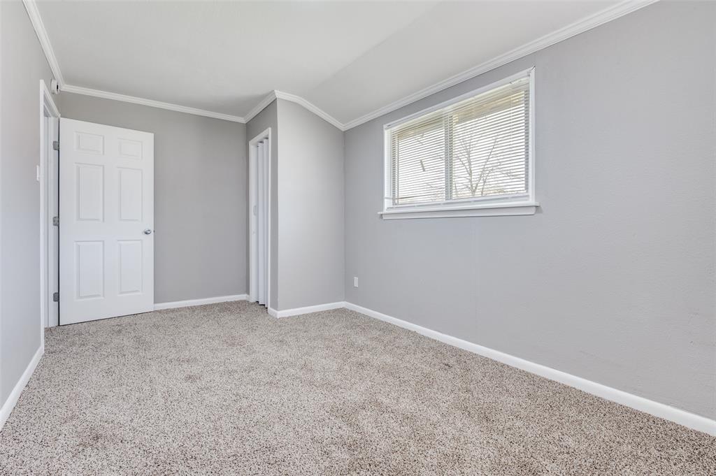 421 West 8th Street Lancaster, TX 75146 - Photo 22 of 28 Carpeted room featuring light gray walls, white trim, and a window with blinds