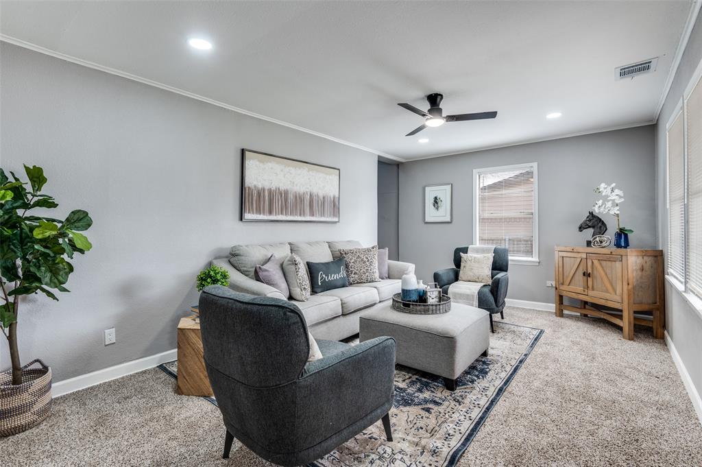 421 West 8th Street Lancaster, TX 75146 - Photo 6 of 28 Living area featuring light gray wall paint, white crown molding, and recessed lighting