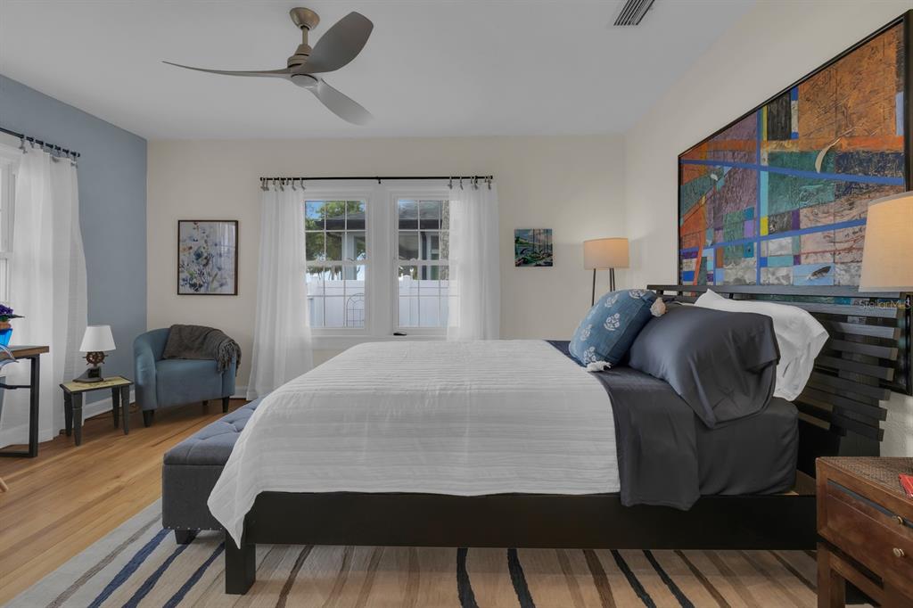 1322 Riverside Drive Titusville, FL 32780 - Photo 11 of 21 a bedroom with a bed a table and chair