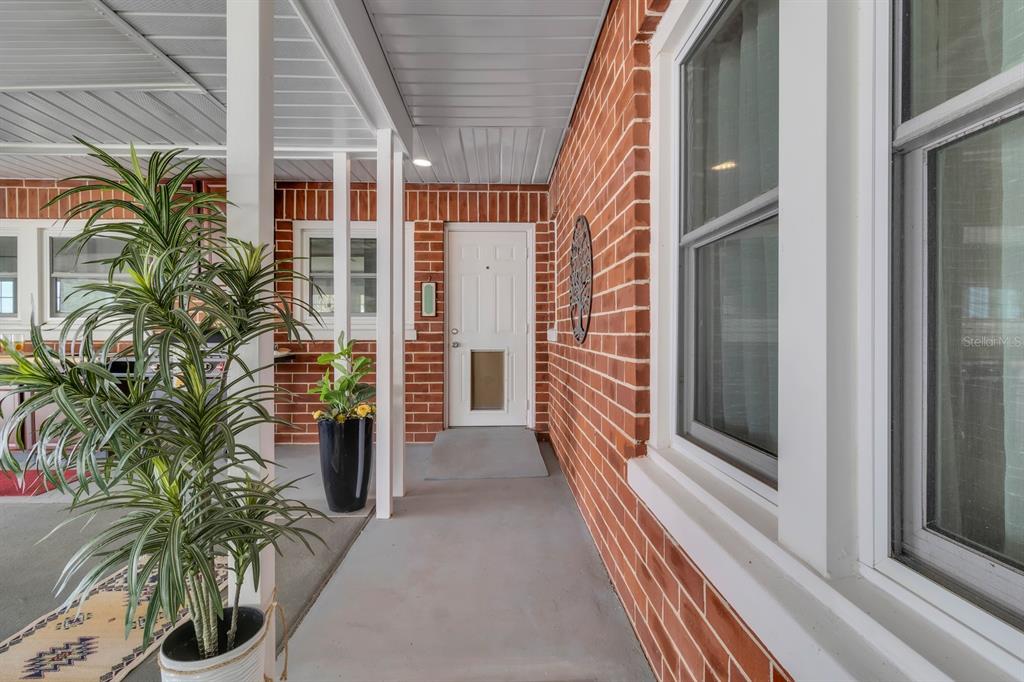 1322 Riverside Drive Titusville, FL 32780 - Photo 16 of 21 a view of a house with a potted plant