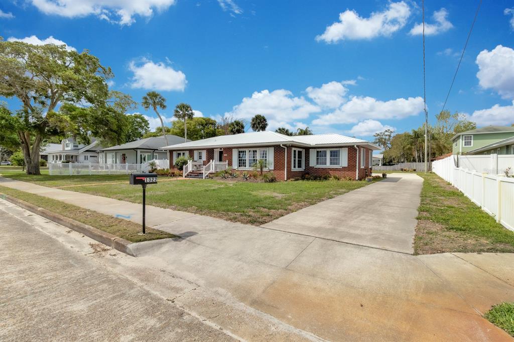 1322 Riverside Drive Titusville, FL 32780 - Photo 18 of 21 a view of a house with a yard
