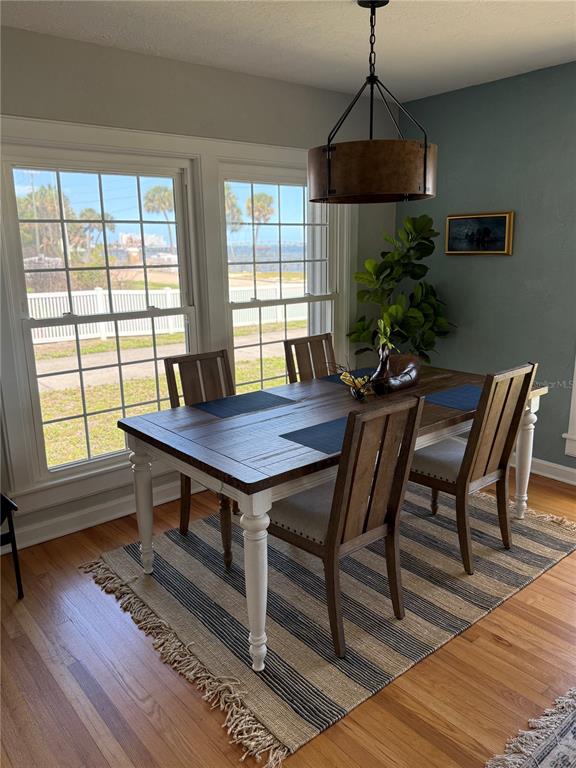 1322 Riverside Drive Titusville, FL 32780 - Photo 7 of 21 a view of a dining room with furniture window and wooden floor
