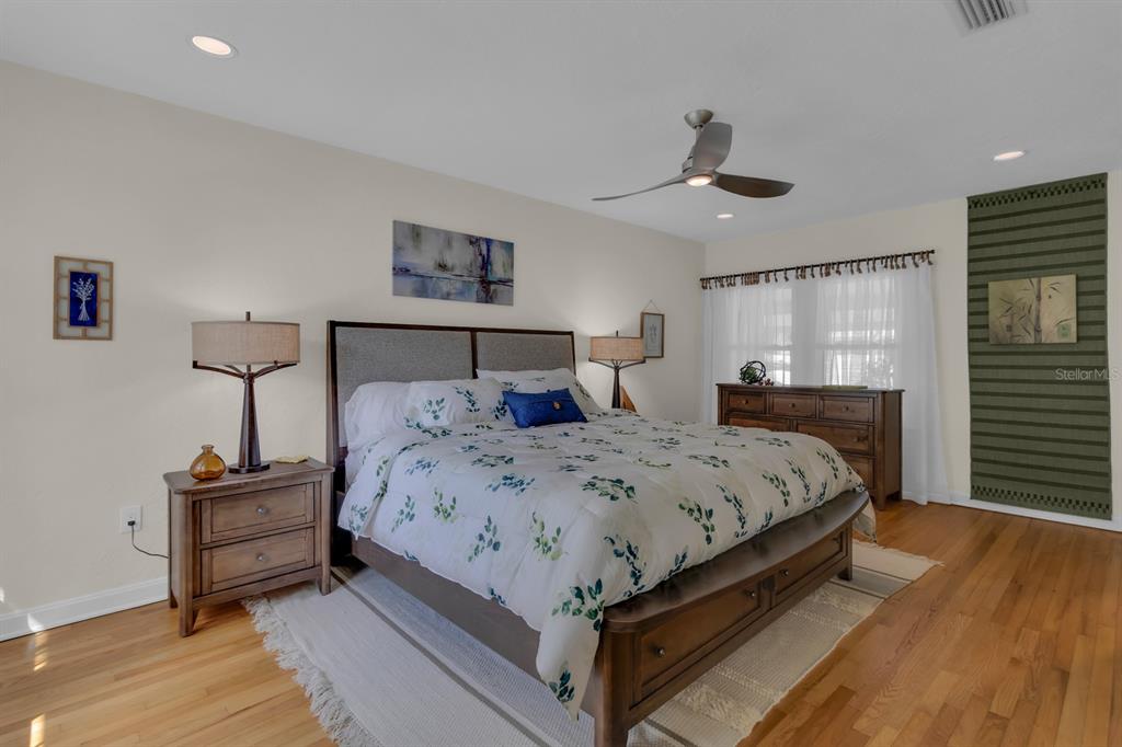 1322 Riverside Drive Titusville, FL 32780 - Photo 9 of 21 a bedroom with a bed and wooden floor