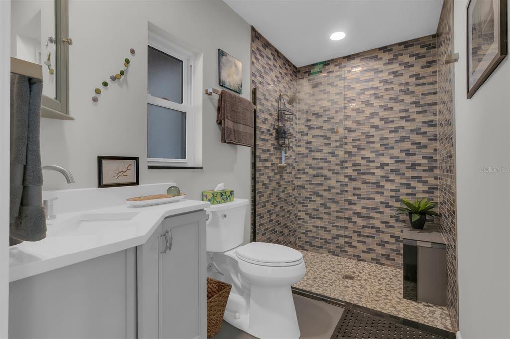 1322 Riverside Drive Titusville, FL 32780 - Photo 10 of 21 a bathroom with a sink toilet and shower