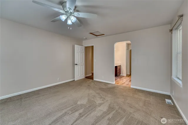 a view of an empty room with a window
