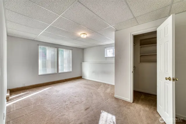 a view of an empty room with a window