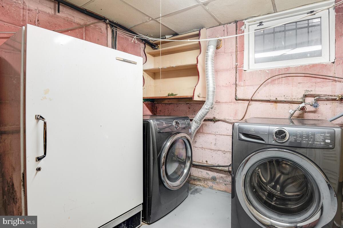 904 Newhall Street Silver Spring, MD 20901 - Photo 34 of 47 Laundry Room w/Front Load Washer & Dryer, Freezer