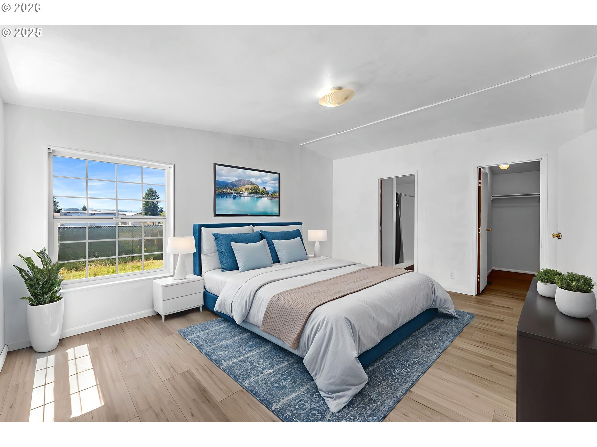 241 Foster Creek Road Toledo, WA 98591 - Photo 12 of 17 a bedroom with a large bed and a large window