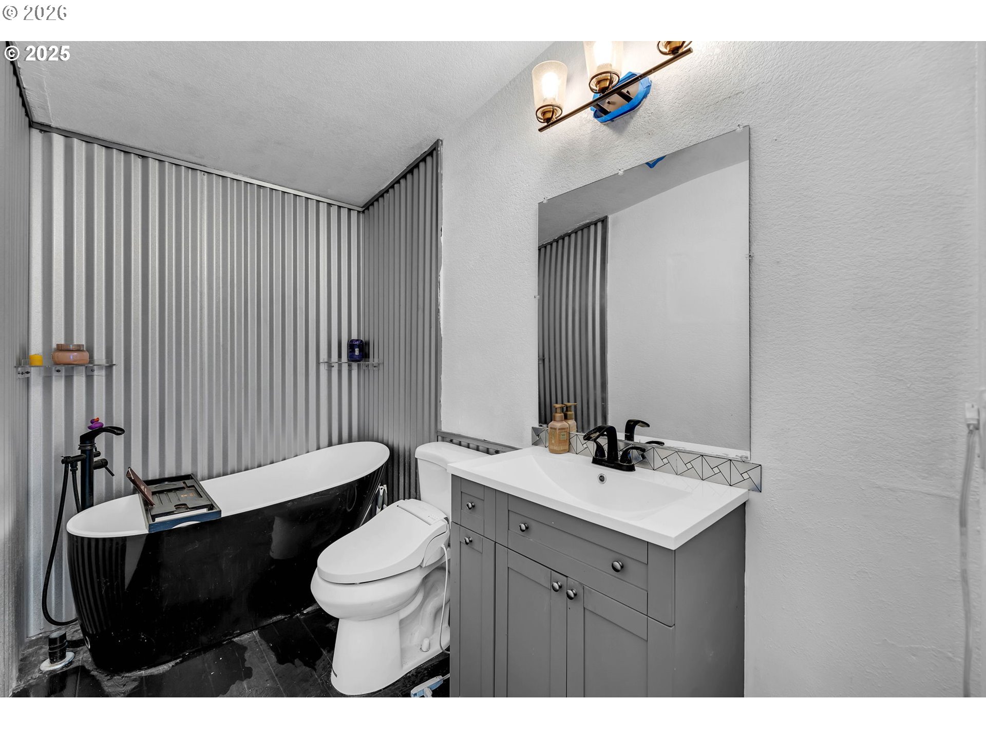 241 Foster Creek Road Toledo, WA 98591 - Photo 14 of 17 a bathroom with a sink vanity mirror and toilet