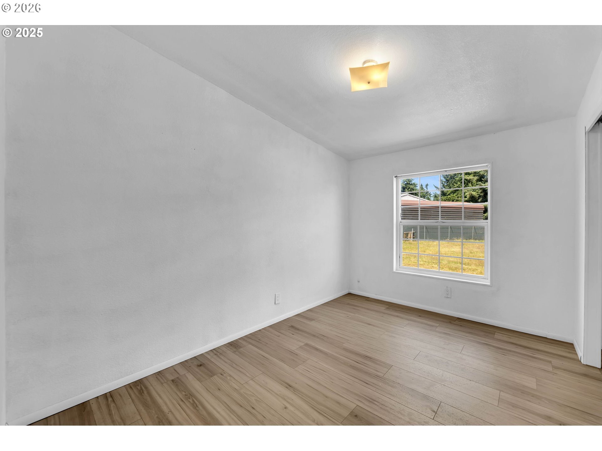241 Foster Creek Road Toledo, WA 98591 - Photo 16 of 17 a view of empty room with wooden floor and fan