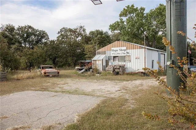 a view of a lake with houses in the back