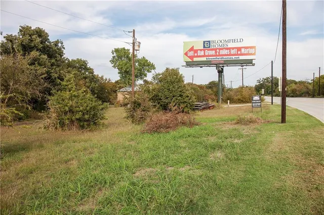 a view of a yard with an ocean view