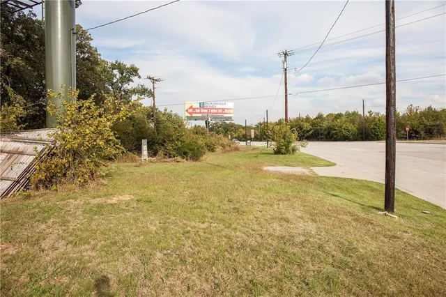 a view of roof deck with large oven and large window