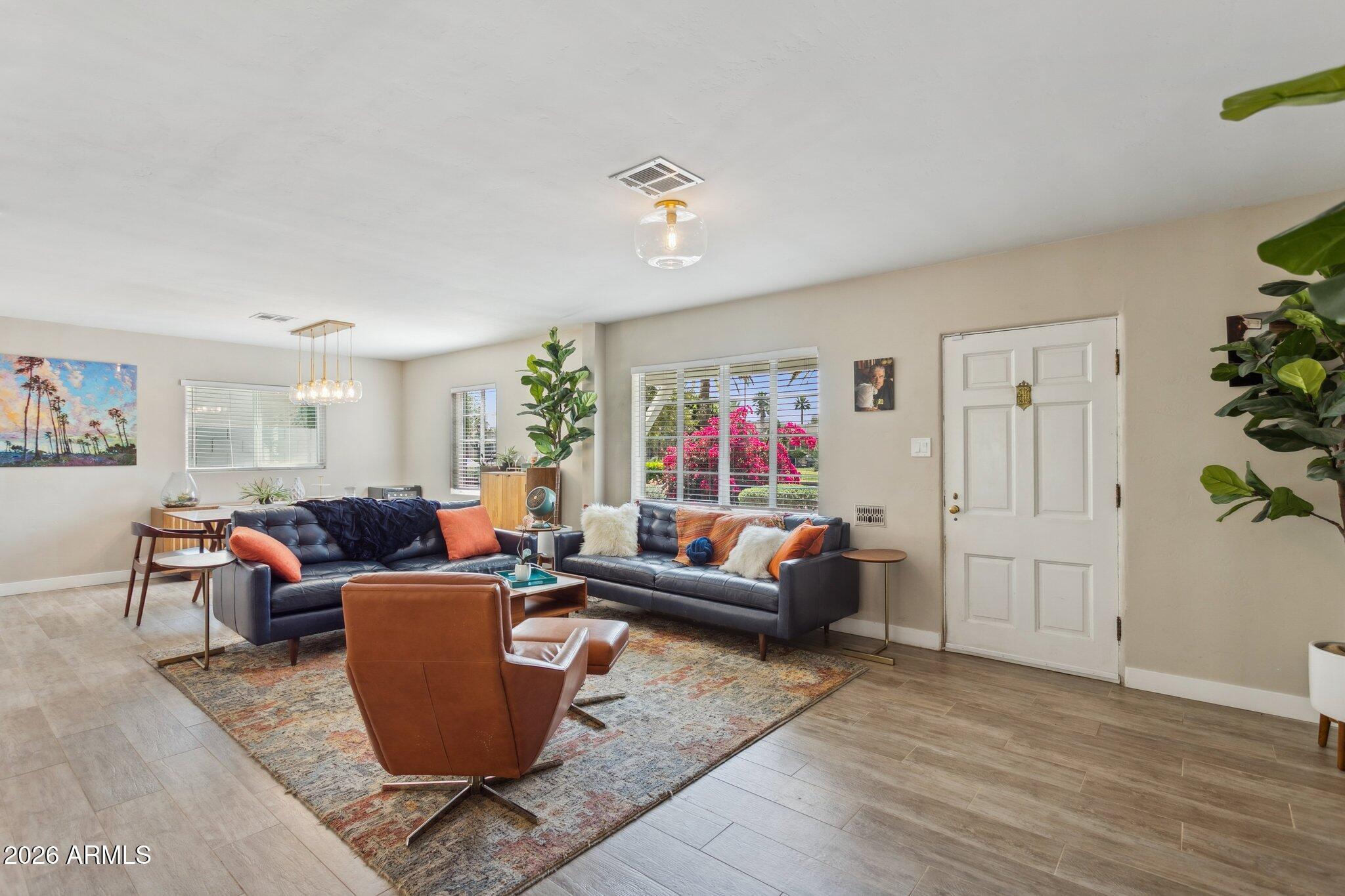 322 West Coronado Road Phoenix, AZ 85003 - Photo 29 of 75 a living room with furniture a refrigerator and a window