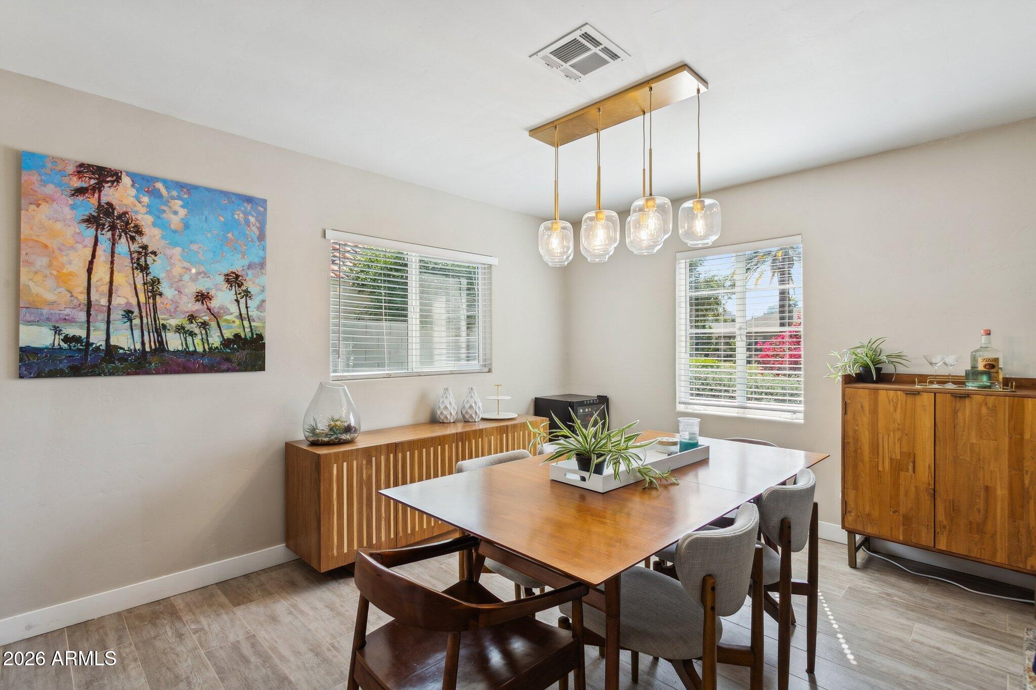 322 West Coronado Road Phoenix, AZ 85003 - Photo 35 of 75 a view of a dining room with furniture window and wooden floor