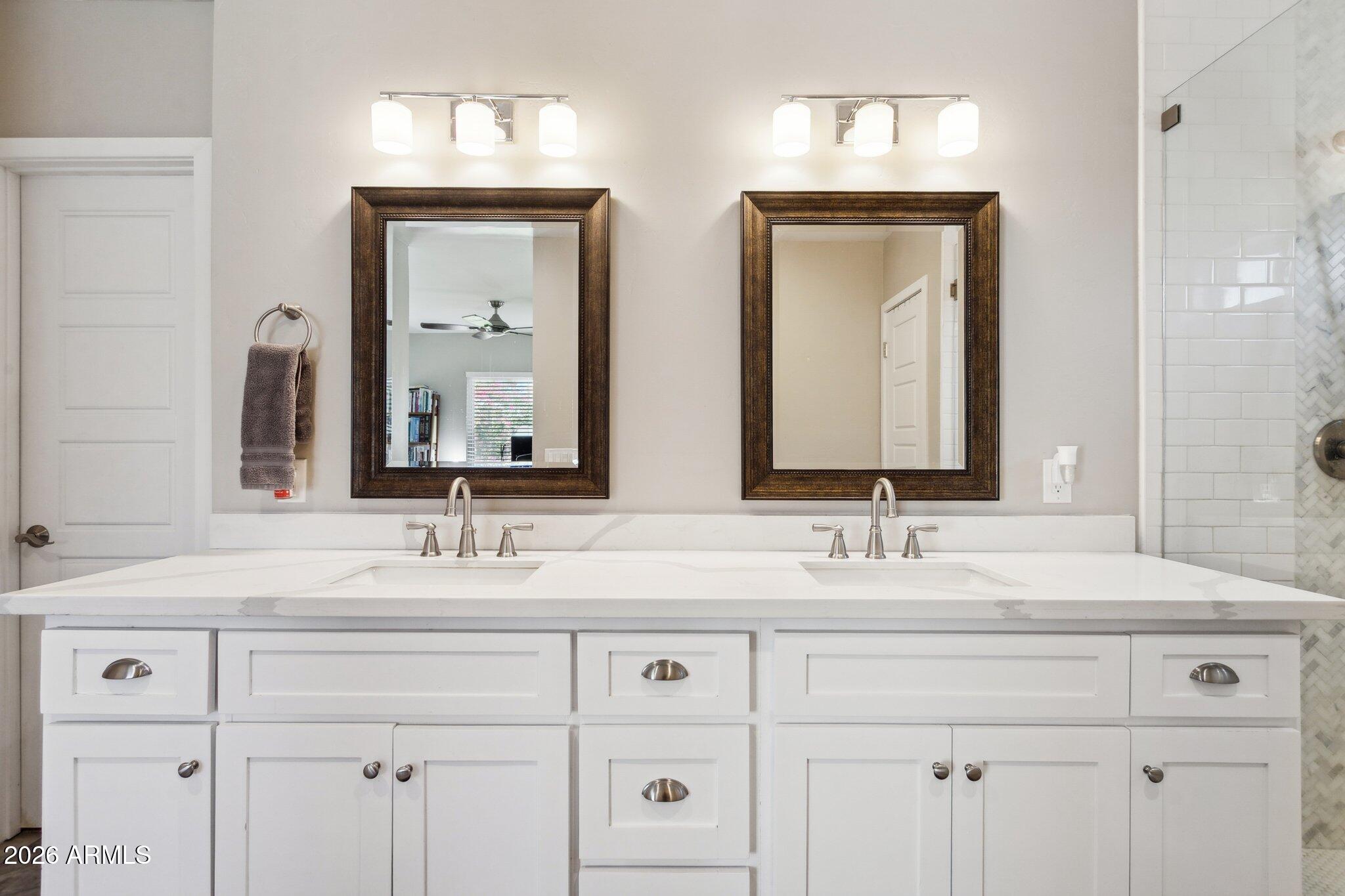 322 West Coronado Road Phoenix, AZ 85003 - Photo 43 of 75 a bathroom with double vanity sinks and a mirror