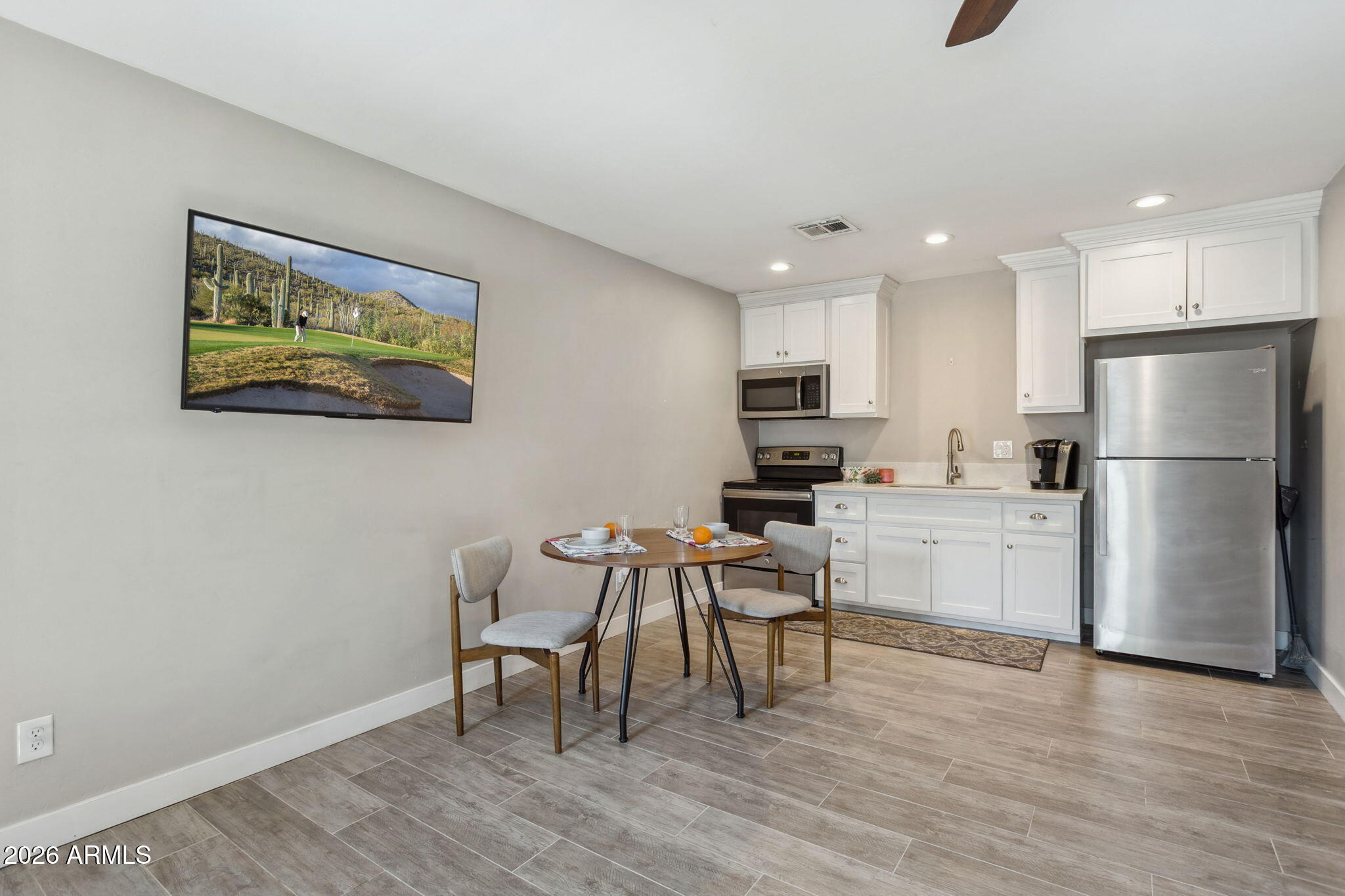322 West Coronado Road Phoenix, AZ 85003 - Photo 52 of 75 a kitchen with stainless steel appliances granite countertop a refrigerator and a stove top oven