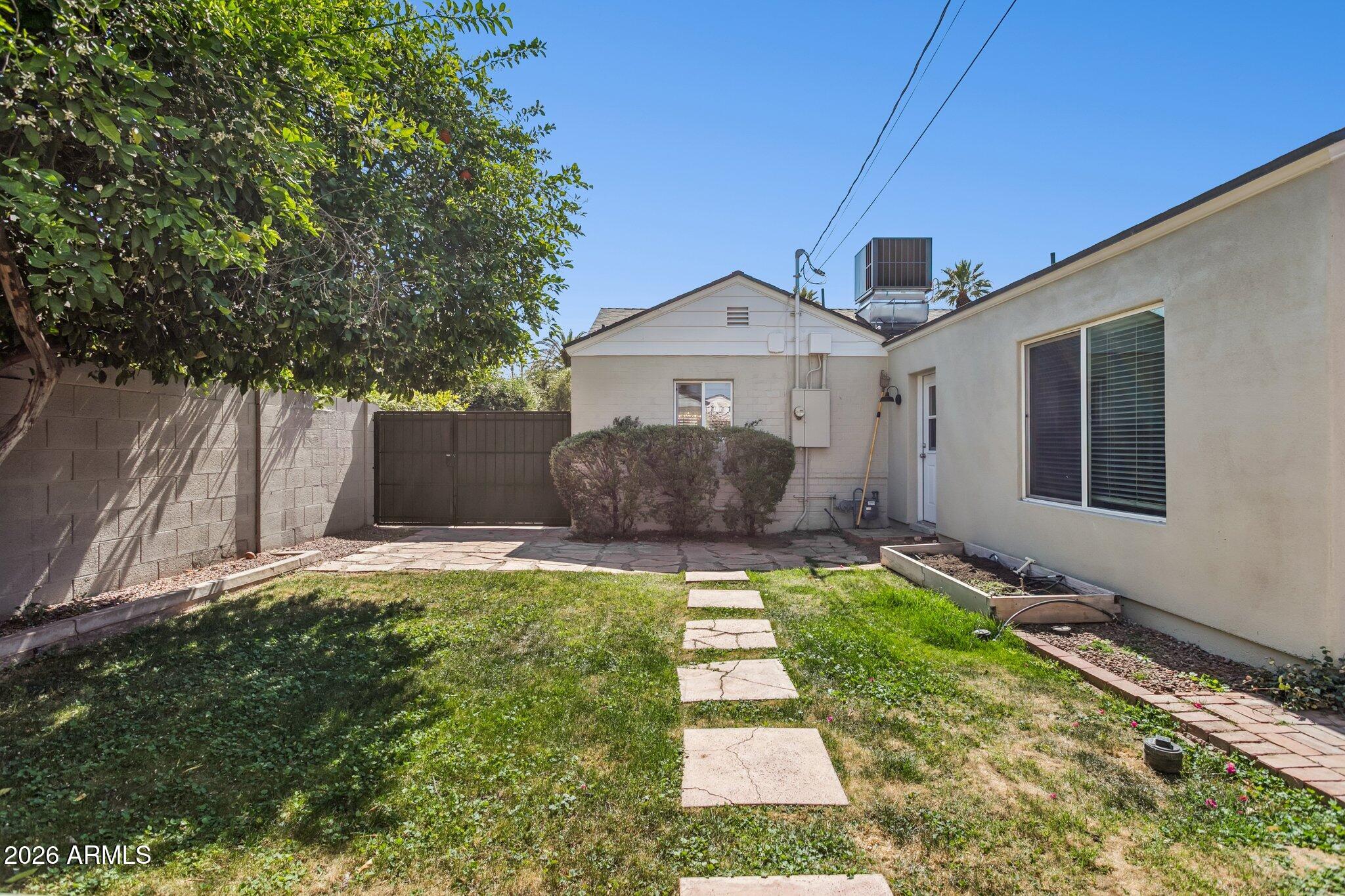 322 West Coronado Road Phoenix, AZ 85003 - Photo 59 of 75 a front view of house with yard