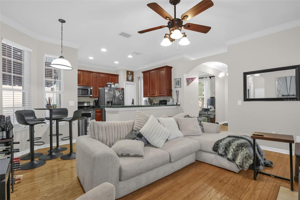 2165 Ridgewood Street Orlando, FL 32803 - Photo 4 of 37 a living room with furniture kitchen view and a chandelier