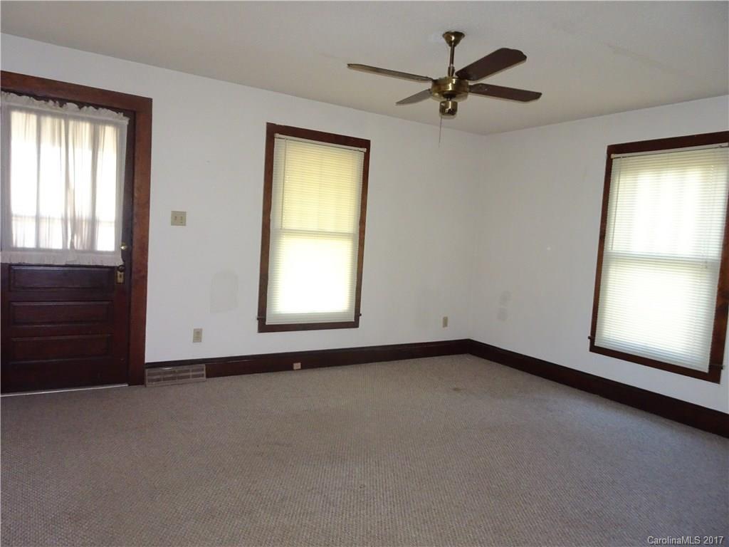 385 Shue Road China Grove, NC 28023 - Photo 2 of 11 an empty room with windows and fan