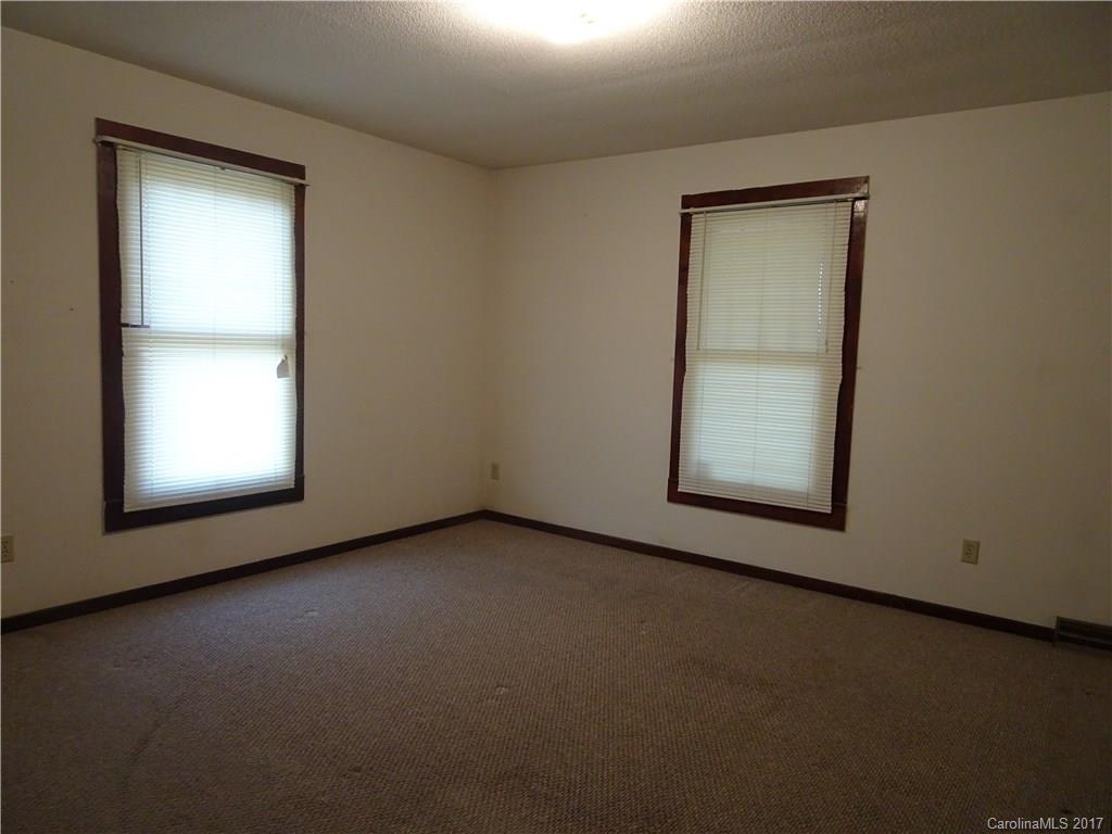385 Shue Road China Grove, NC 28023 - Photo 4 of 11 an empty room with windows and closet