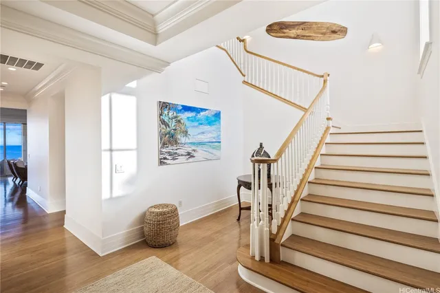 a room with stairs and a rug