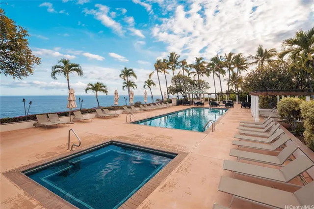 a view of swimming pool with chairs