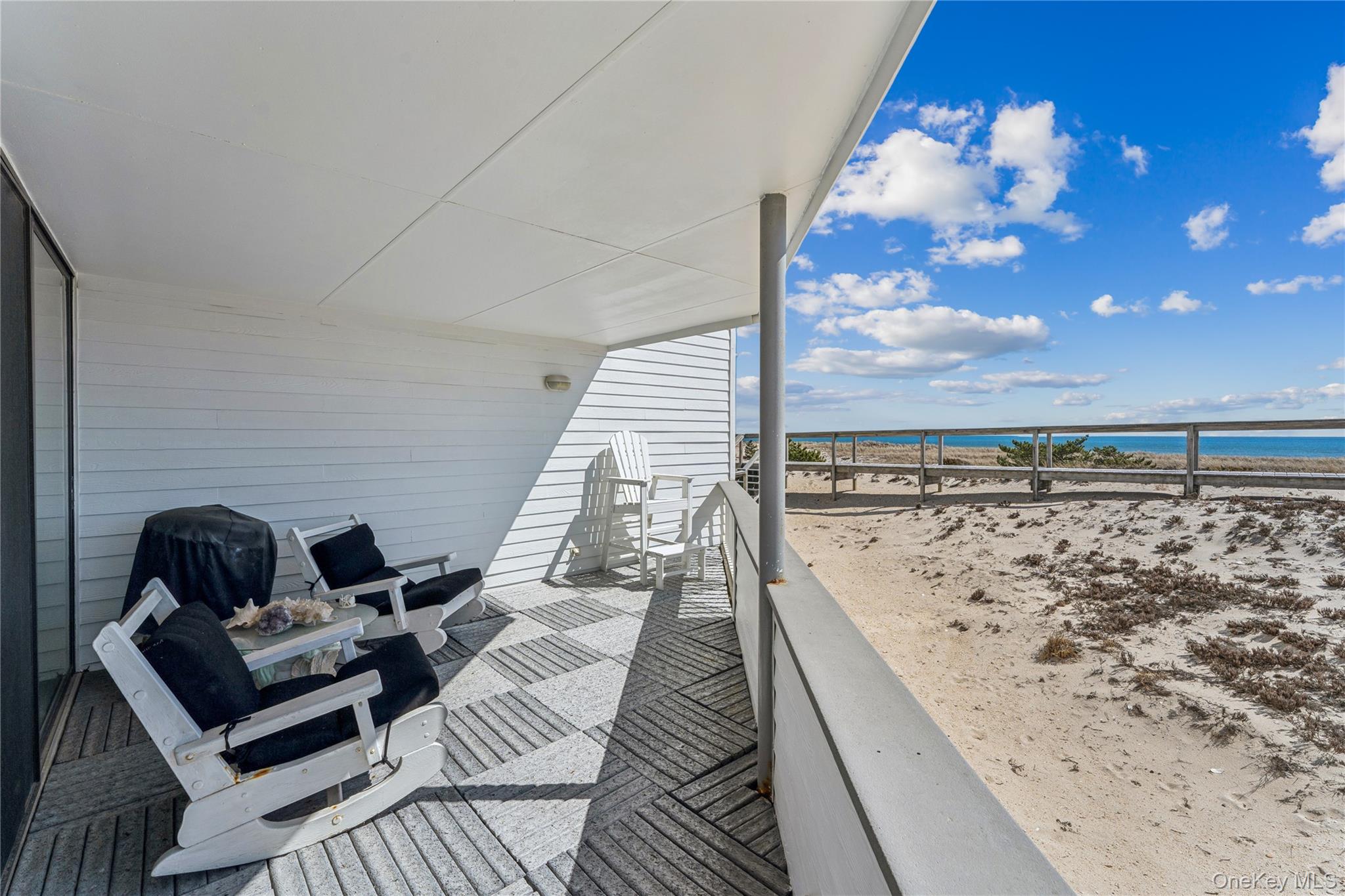 253 Dune Road, Unit 48 Westhampton Beach, NY 11978 - Photo 15 of 28 a view of roof deck with patio