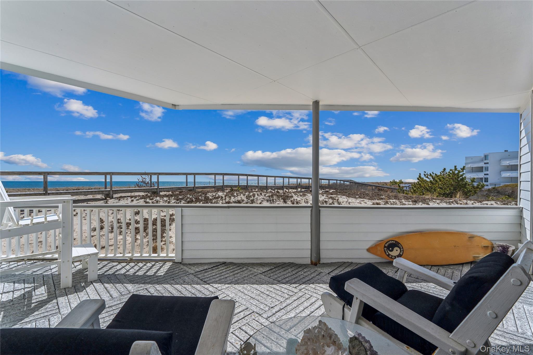 253 Dune Road, Unit 48 Westhampton Beach, NY 11978 - Photo 16 of 28 a view of a living room and dining room