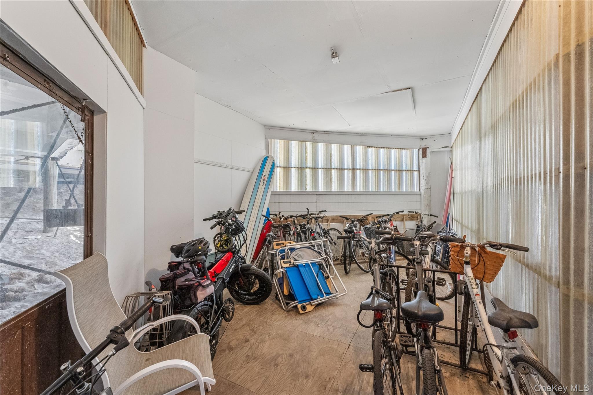 253 Dune Road, Unit 48 Westhampton Beach, NY 11978 - Photo 18 of 28 a view of a room with gym equipment