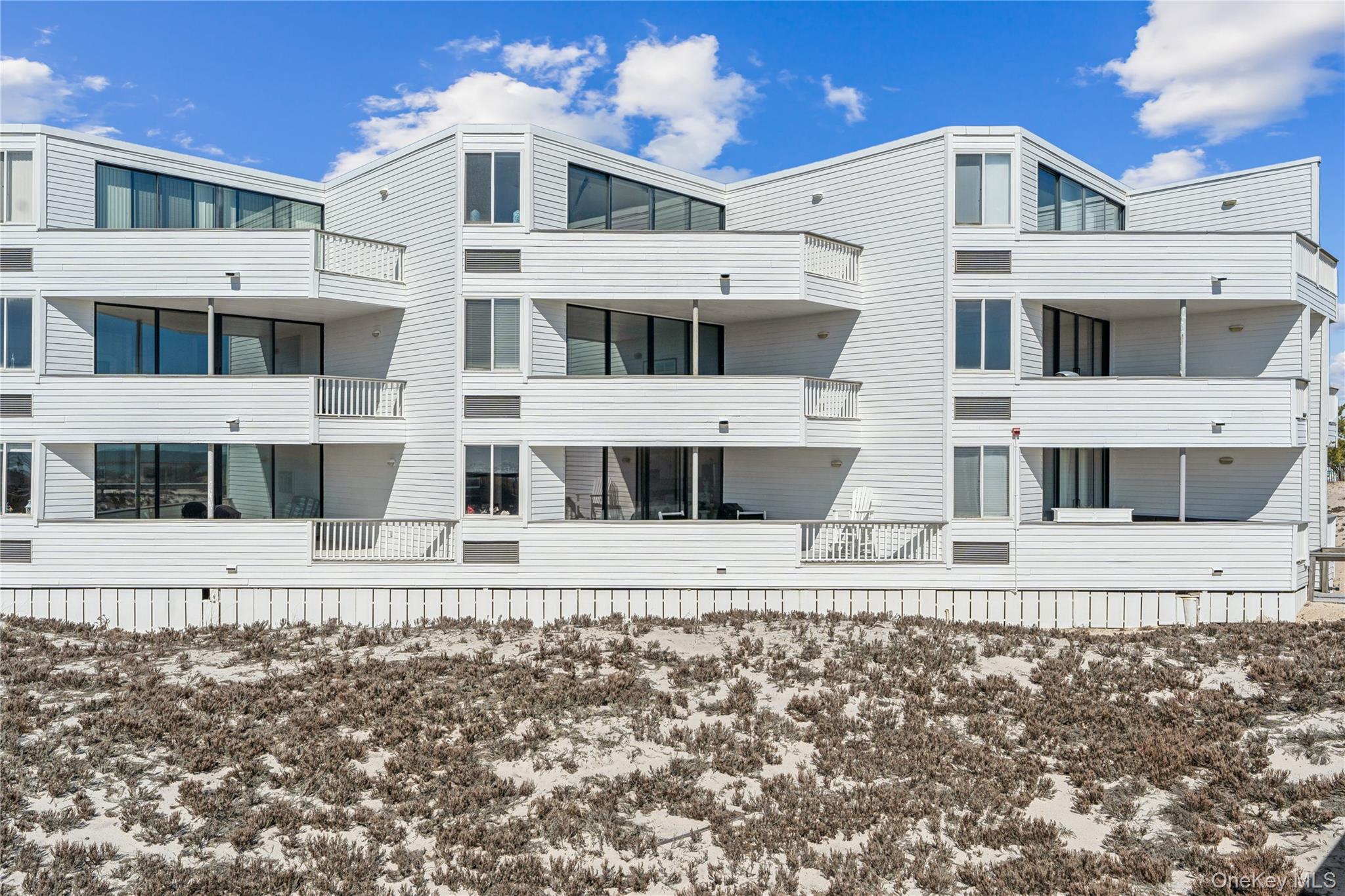 253 Dune Road, Unit 48 Westhampton Beach, NY 11978 - Photo 27 of 28 a view of a large building