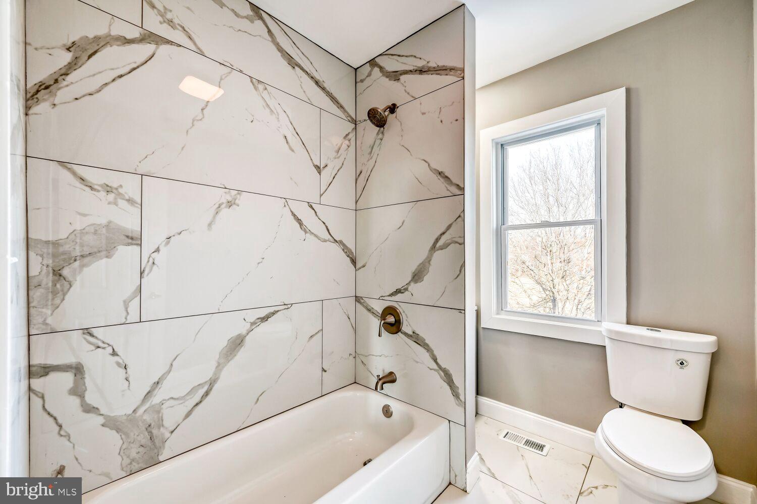 2647 Chesterfield Avenue Baltimore, MD 21213 - Photo 18 of 28 Elegant marble bath with natural light.