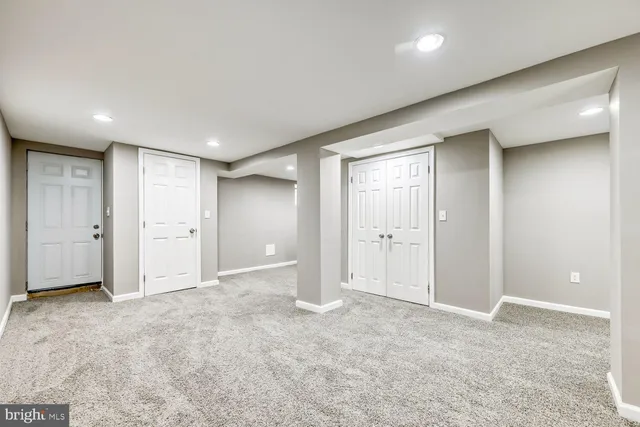 an empty room with closet area