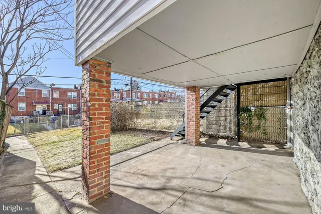 a view of a blue house with a yard