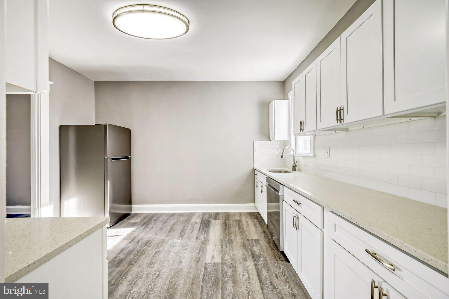 2647 Chesterfield Avenue Baltimore, MD 21213 - Photo 7 of 28 Modern kitchen with sleek finishes.