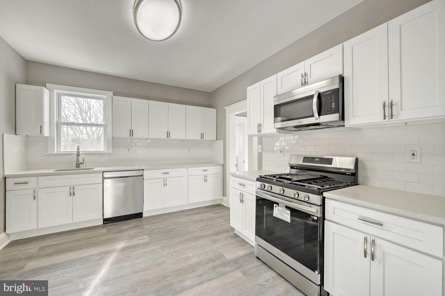 2647 Chesterfield Avenue Baltimore, MD 21213 - Photo 8 of 28 Bright and modern kitchen with sleek finishes.