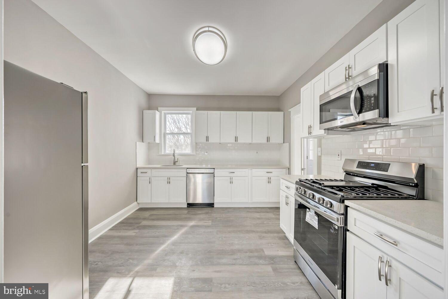 2647 Chesterfield Avenue Baltimore, MD 21213 - Photo 9 of 28 Modern kitchen with sleek finishes.