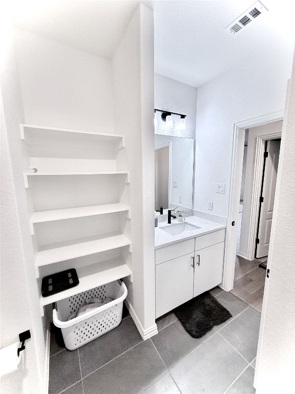 1209 Cole Ests Drive Georgetown, TX 78628 - Photo 22 of 33 Bathroom featuring vanity and light tile patterned flooring