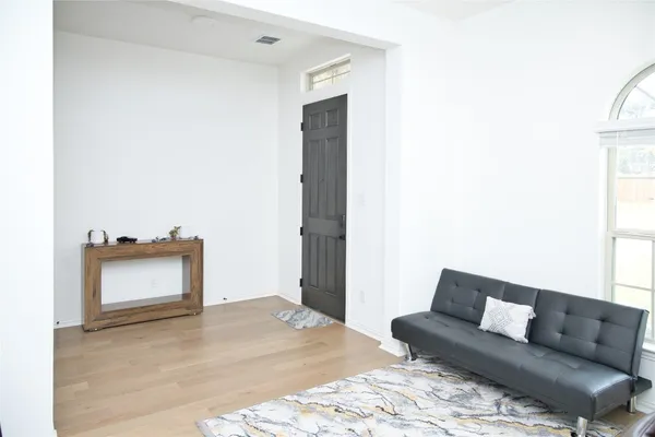 a living room with a bed and a couch