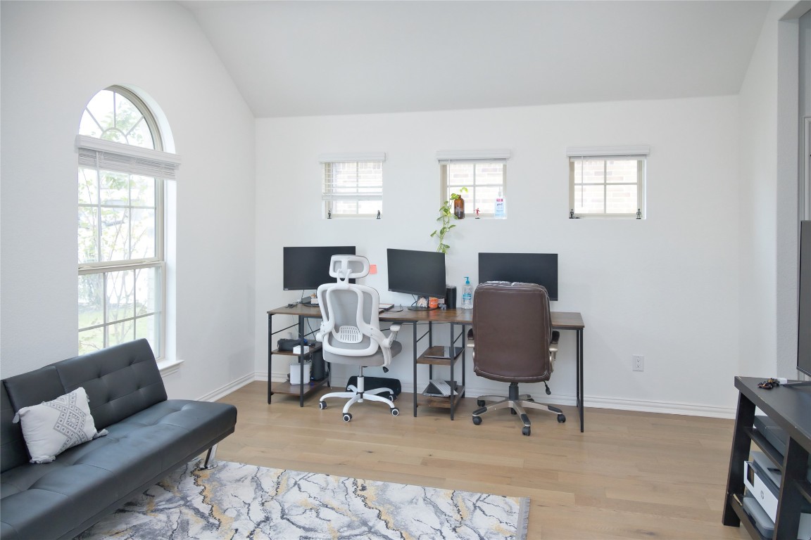 1209 Cole Ests Drive Georgetown, TX 78628 - Photo 8 of 33 Home office with lofted ceiling and light wood finished floors