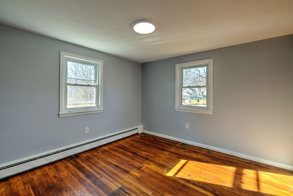 138 Coy Hill Road Warren, MA 01083 - Photo 16 of 42 a view of a room with wooden floor and window