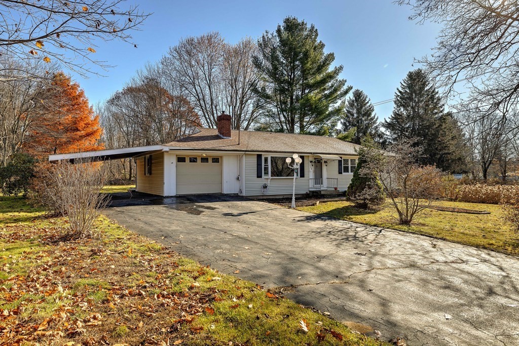 138 Coy Hill Road Warren, MA 01083 - Photo 25 of 42 a view of a house with a yard covered with snow in the background