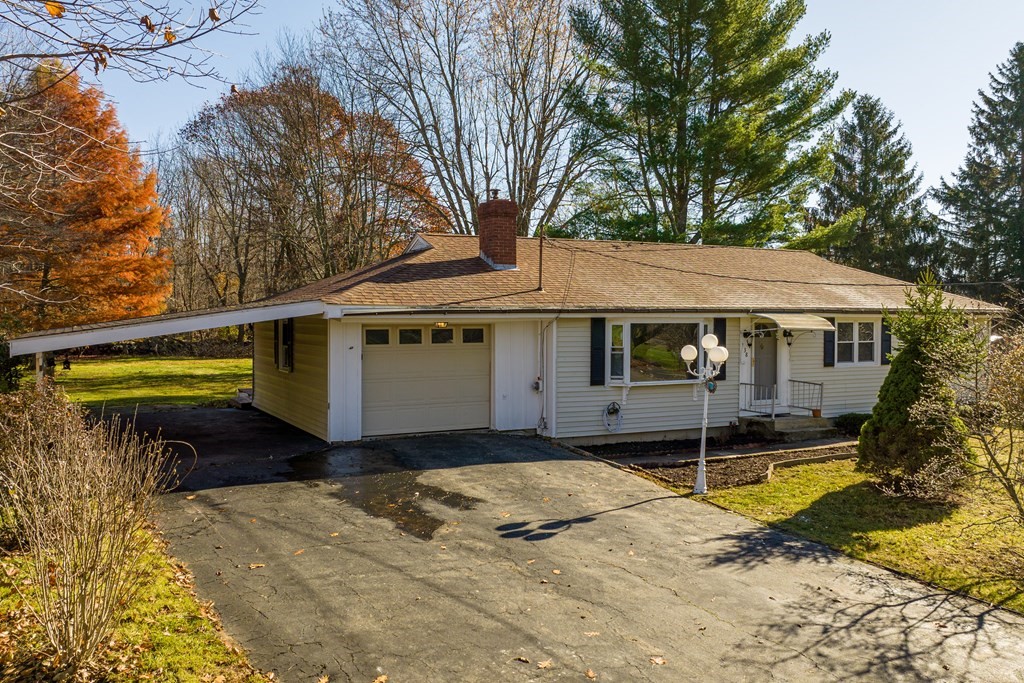 138 Coy Hill Road Warren, MA 01083 - Photo 36 of 42 a front view of a house with a yard