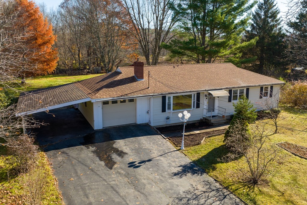 138 Coy Hill Road Warren, MA 01083 - Photo 42 of 42 a front view of a house with a yard