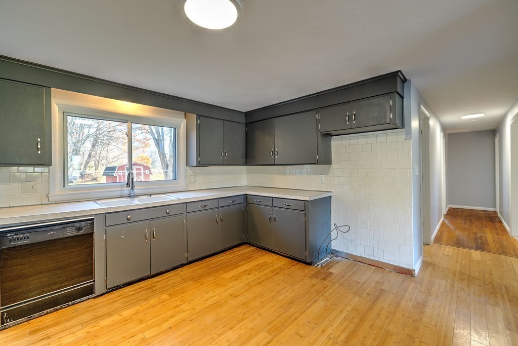 138 Coy Hill Road Warren, MA 01083 - Photo 8 of 42 a kitchen with stainless steel appliances granite countertop a sink and cabinets