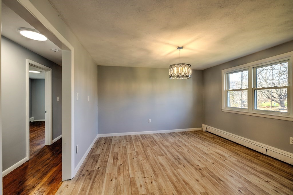 138 Coy Hill Road Warren, MA 01083 - Photo 10 of 42 wooden floor in an empty room with a window