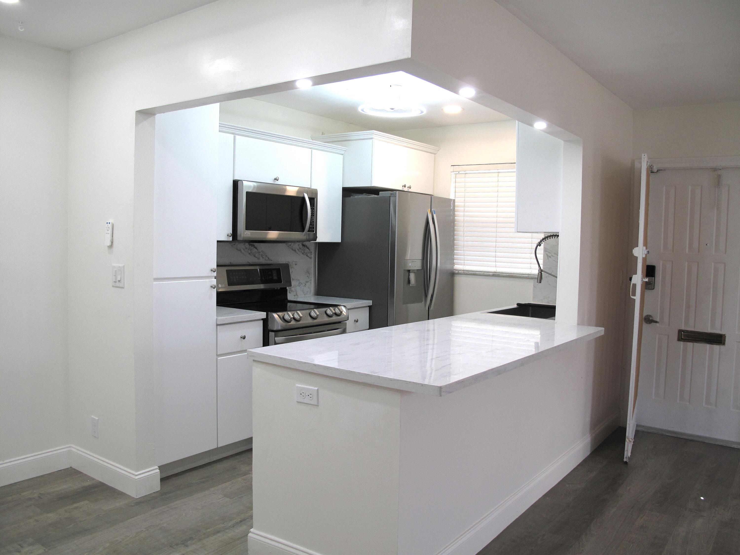 1217 South Drive Way, Unit A Delray Beach, FL 33445 - Photo 1 of 48 Open Concept Kitchen (2)