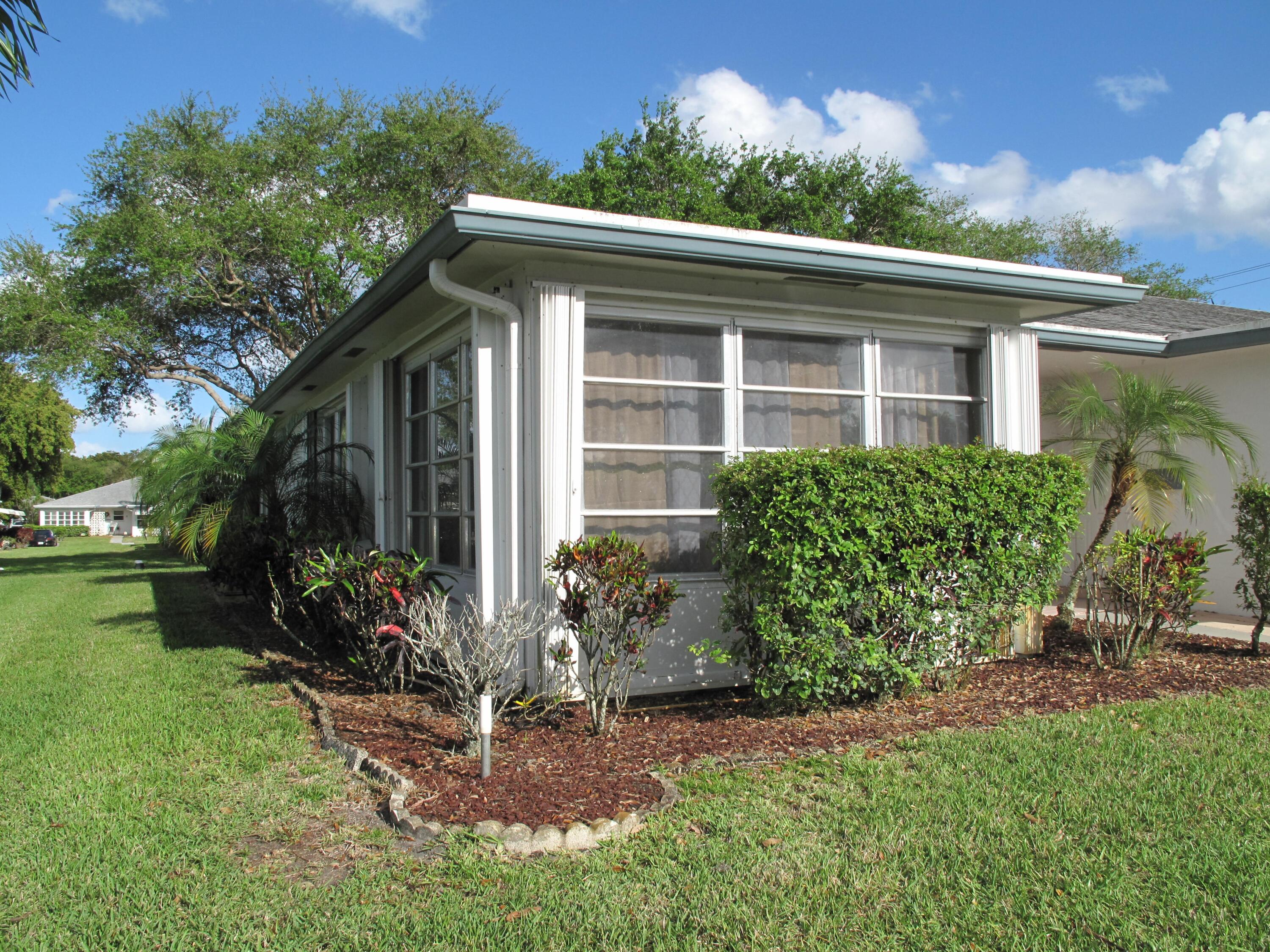 1217 South Drive Way, Unit A Delray Beach, FL 33445 - Photo 2 of 48 Front view of corner villa (2)
