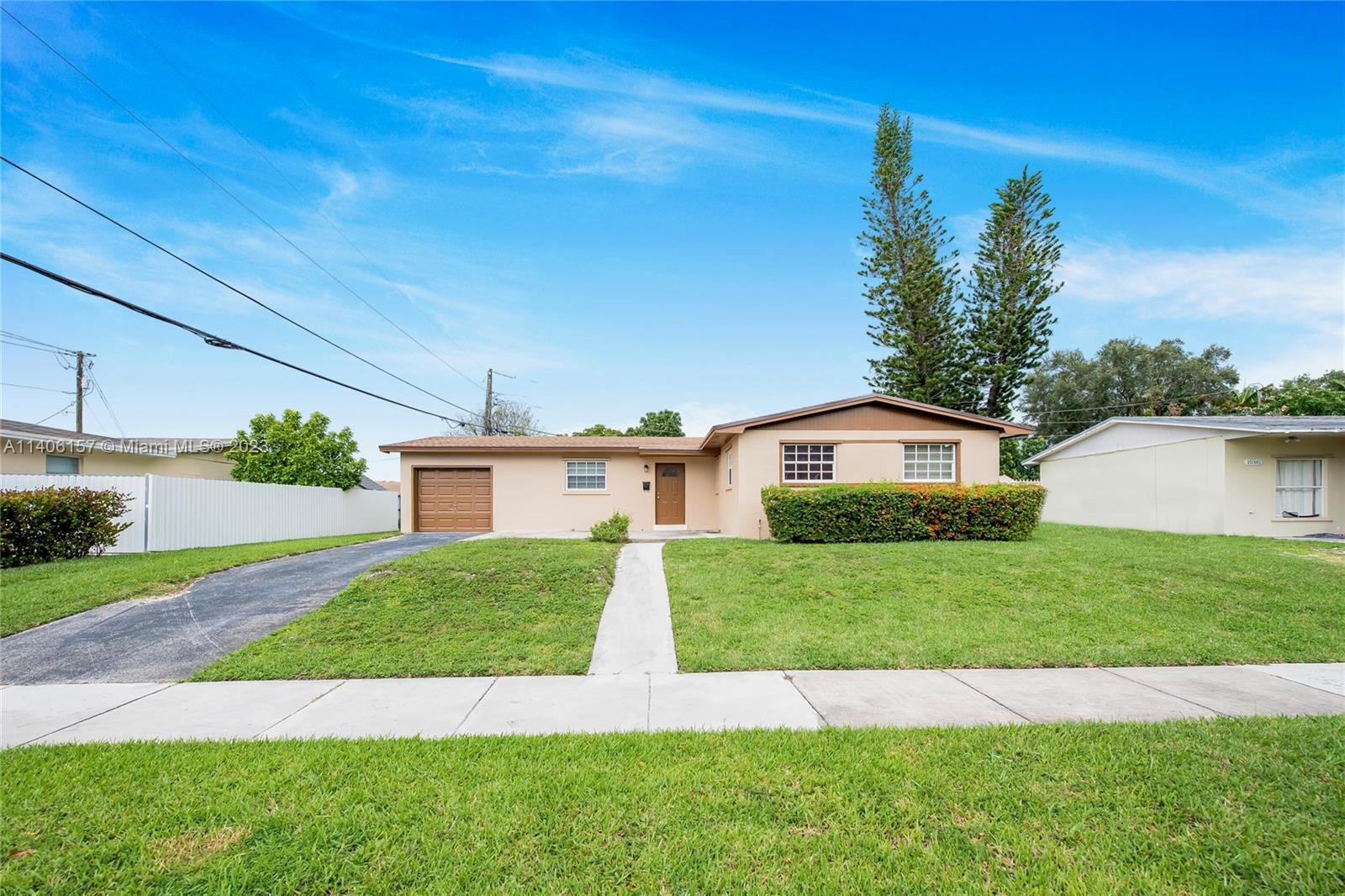 10391 Southwest 156th Street Miami, FL 33157 - Photo 1 of 33 a view of backyard of a house with a garden and plants