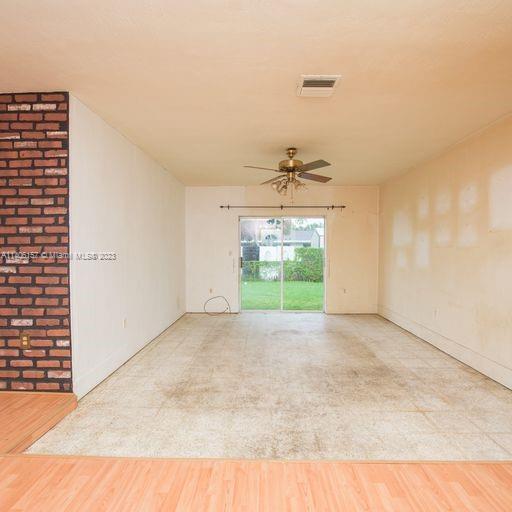 10391 Southwest 156th Street Miami, FL 33157 - Photo 11 of 33 a view of an empty room with a window